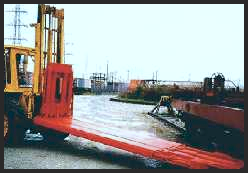 An image of an intermodal railway jack with a portable skid mount